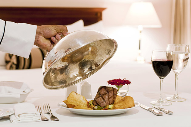 Many cruise line raised gratuity and room service fees this year. (photo: ruidoblanco/Shutterstock) room service meal