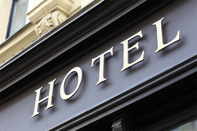 Arrange for a pre- or post-cruise hotel stay (Photo: Chubykin Arkady/Shutterstock) hotel sign