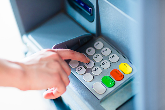 Have cash on hand (Photo: PKpix/Shutterstock) Girl entering pin into ATM machine