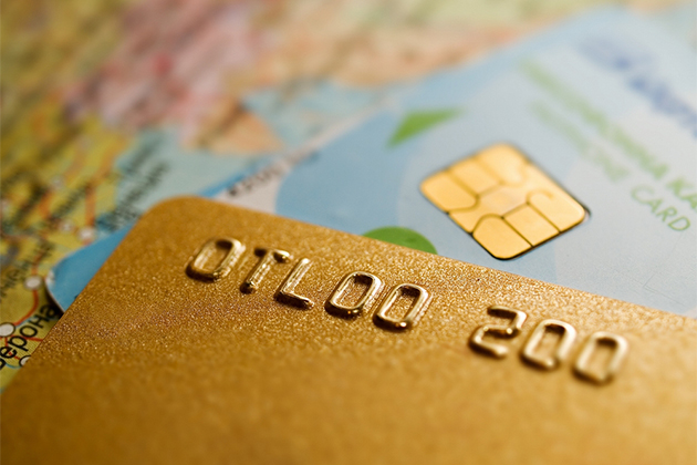 Enjoy cruise perks through your credit card company (Photo: MishAl/Shutterstock) Credit cards and a world map
