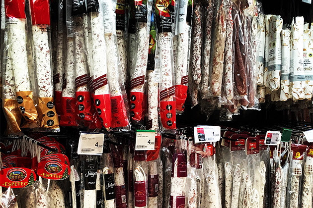 Head to the cellar for local foodstuffs (Photo: Carolyn Spencer Brown) Various meats and salamis in Barcelona's El Corte