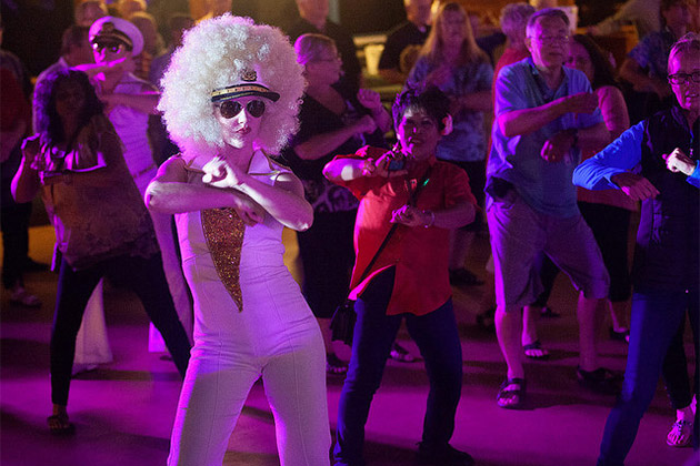 The Love Boat anniversary cruise on Pacific Princess (Photo: Amanda Castleman) Woman dancing in retro attire on Love Boat cruise