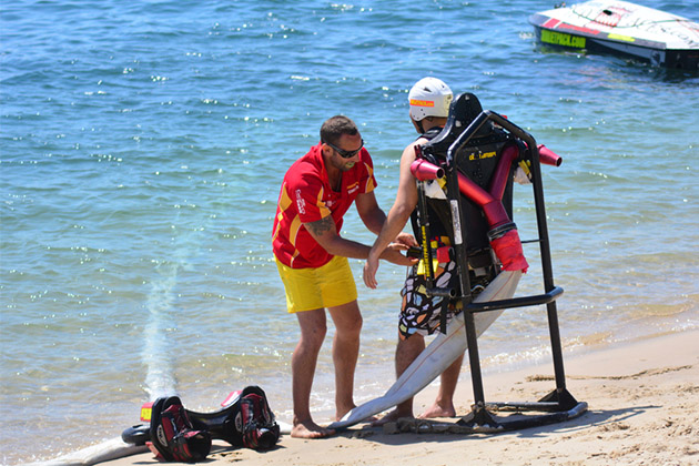 An instructor prepares a client for flyboarding (Photo: ChameleonsEye/Shutterstock) An instructor prepares a client for flyboarding