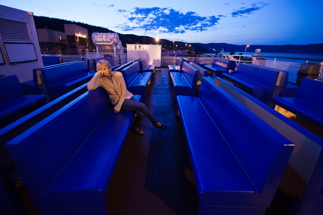 You may run out of things to do on-board with all the time at sea. (photo: Benoit Daoust/Shutterstock) Woman alone on a ship deck