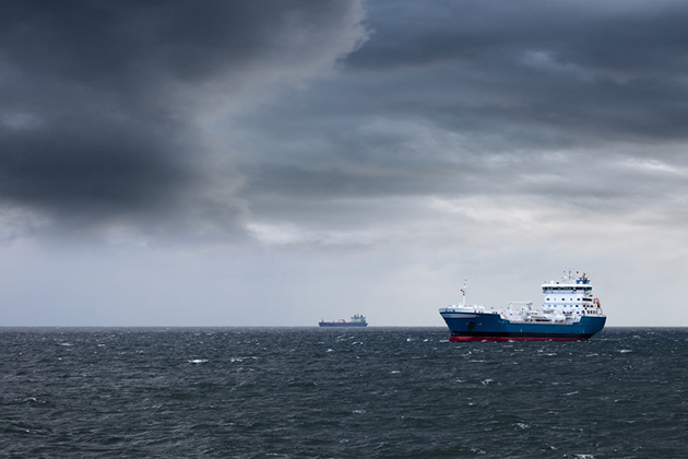 Stormy Sky Cruise (Photo: Nightman1965/ Shutterstock) Dark cloudy stormy sky with ship and waves in the sea.
