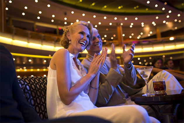 The Constellation Theater on Seven Seas Voyager (Photo: Regent Seven Seas Cruises) Couple applauding at a show in the Constellation Theater
