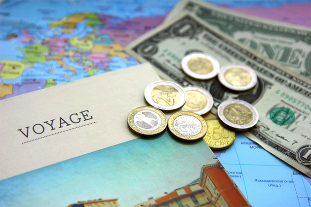 More expensive cruise lines (Photo: Natalia Danchenko/Shutterstock) Cruise pamphlet with map and assorted currencies