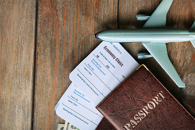 Fly in early if you're traveling abroad (Photo: Africa Studio/Shutterstock) Passport and toy plan