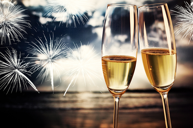 Cruise Holiday Parties (Photo: melis/ Shutterstock) Champagne glasses on tropical beach at sunset