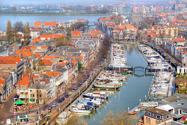 Dutch Village of Dordrecht (Photo: Chantal de Bruijne/ Shutterstock) the Dutch village of Dordrecht seen form above, Dordrecht is the oldest ciy in het Netherlands and lays against the mas river and has beautiful canals