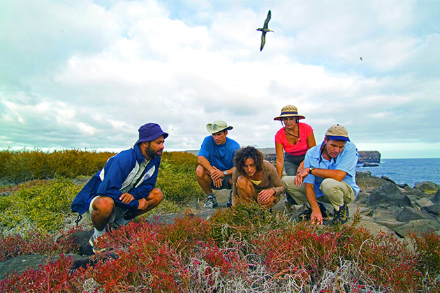 Galapagos shore excursion (Photo: Celebrity Cruises) Galapagos tour guide talking to group of Celebrity cruise passengers