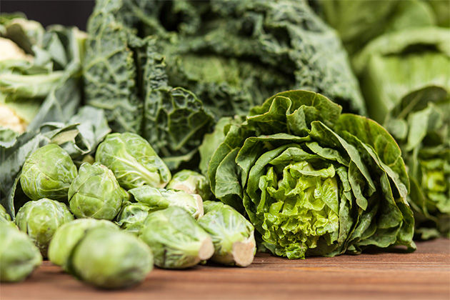 Load up on lean protein and green leafy vegetables (Photo: George Dolgikh/Shutterstock.com) Assortment of green vegetables on wooden surface
