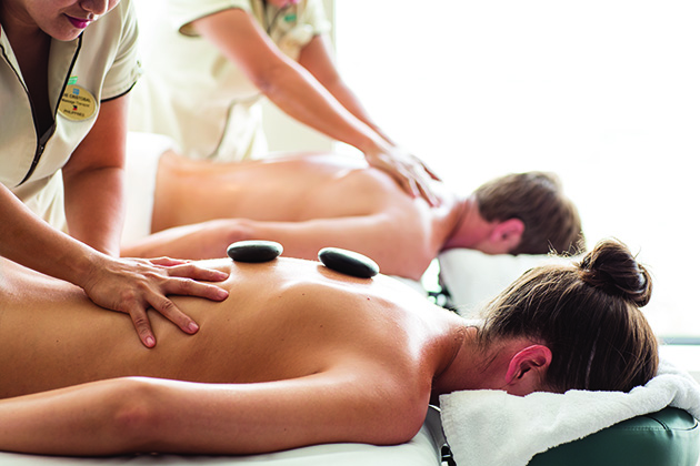 Hot stone massage on Norwegian Getaway (Photo: Norwegian Cruise Line) A couple receiving a hot stone massage on Norwegian Cruise Line