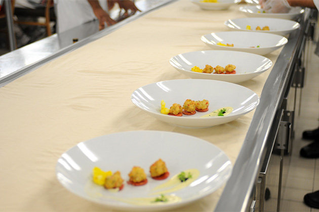 The Chef's Table experience on Carnival (Photo: Carnival) Plates lined up for Chef's Table
