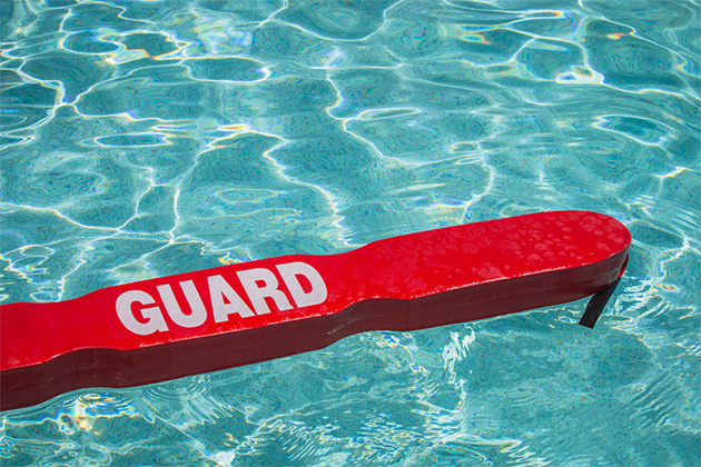 Cruise line lifeguards (Photo: Randy Hines/Shutterstock.com) A close up shot of a life guards red rescue tube floating in a pool