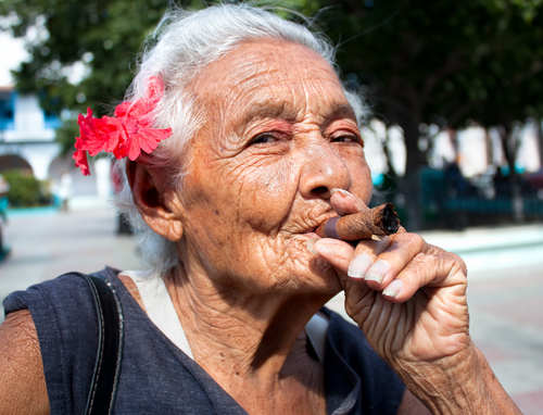 Old woman with cigar in Cuba (Aleksandar Todorovic/Shutterstock) Old woman smoking cigar in Cuba