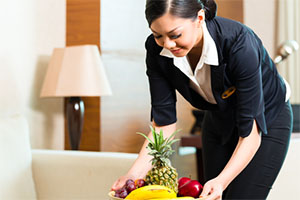Maid preparing a fruit basket (photo: Kzenon/Shutterstock) Maid preparing a fruit basket