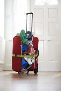 Overpacked suitcase. Photo courtesy bikeriderlondon/Shutterstock overstuffed suitcase overpack cruise luggage