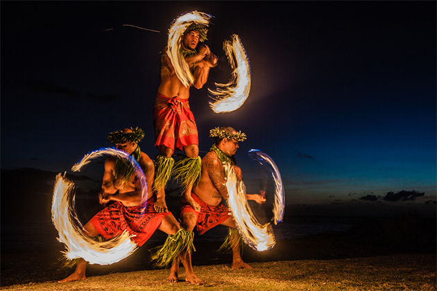 Fire dancers at a luau in Hawaii (photo: Deborah Kolb/Shutterstock.com) Hawaii Cruise Tips