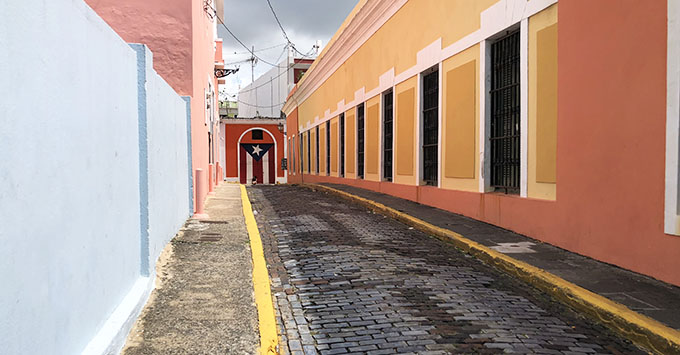 A flag of Puerto Rico painted at the end of an alley in Old San Juan (Photo: Brittany Chrusciel) A flag of Puerto Rico painted at the end of an alley in Old San Juan